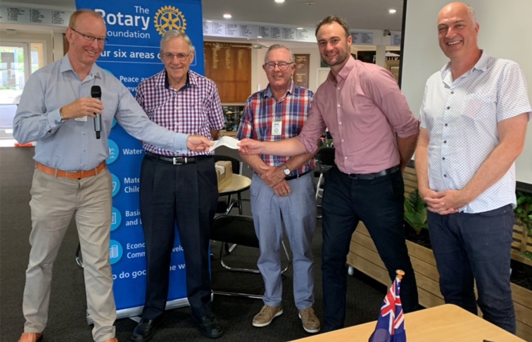 East Coast Bays Rotary presenting Well Foundation with money raised through our community partnership